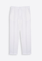 Model wearing white linen trousers with lightweight summer elegance East Vibe